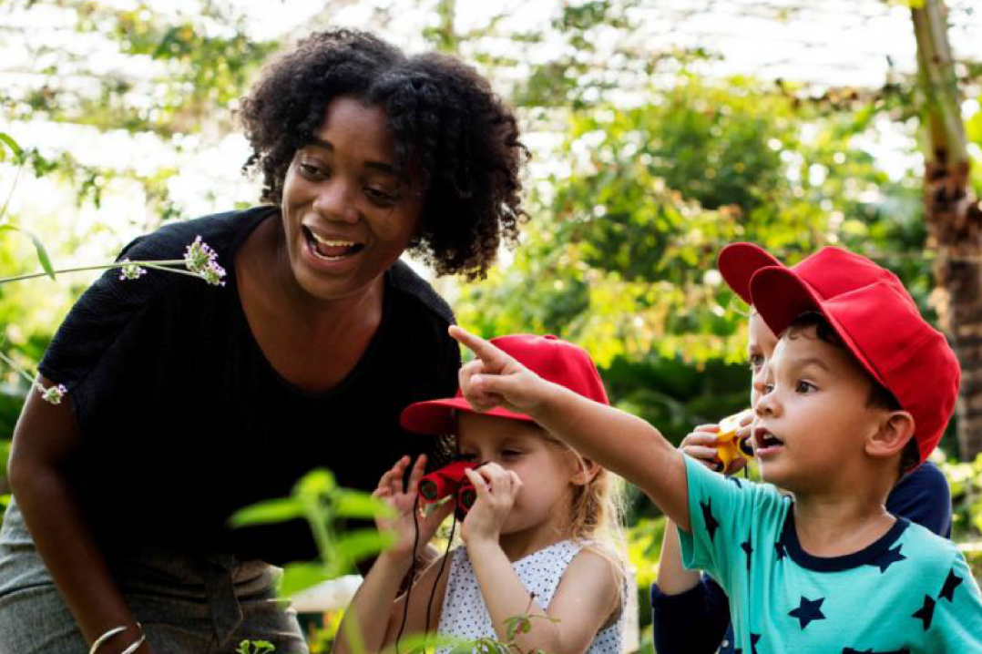 A teacher and students exploring